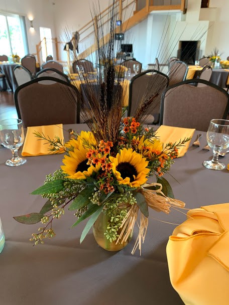 Floral arrangement at the center of table setting