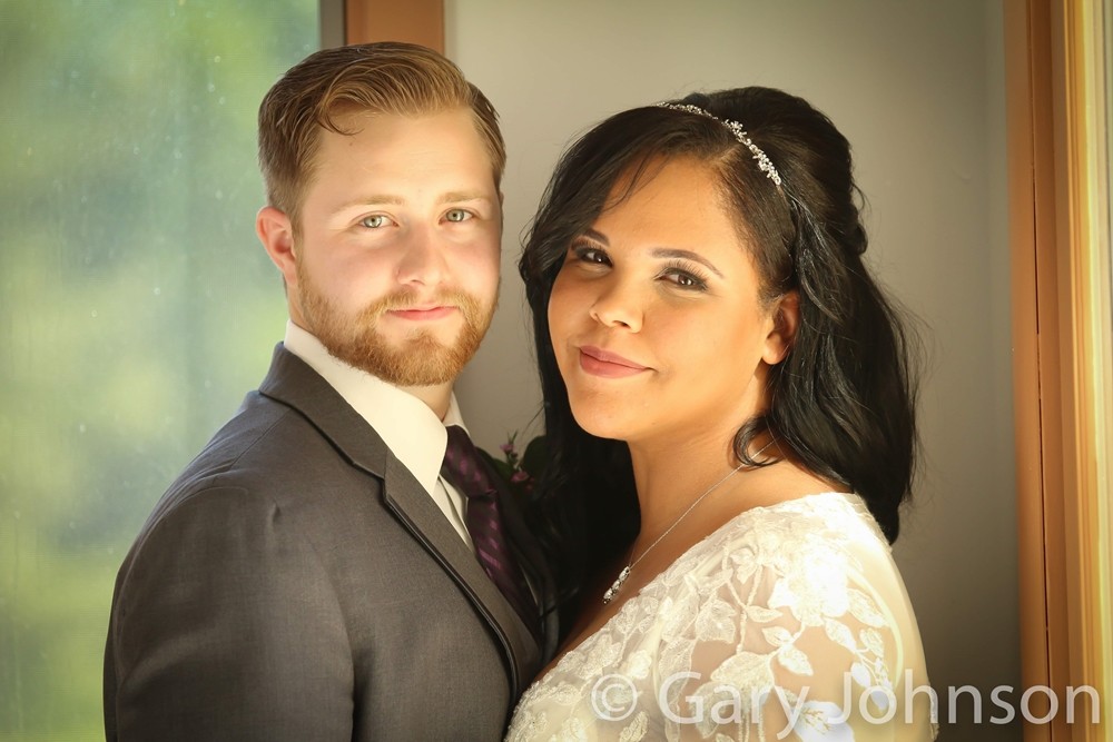 Portrait shot of bride and groom smiling