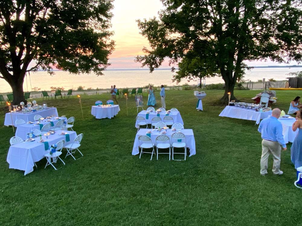 Event tables with white table cloth setup outdoors
