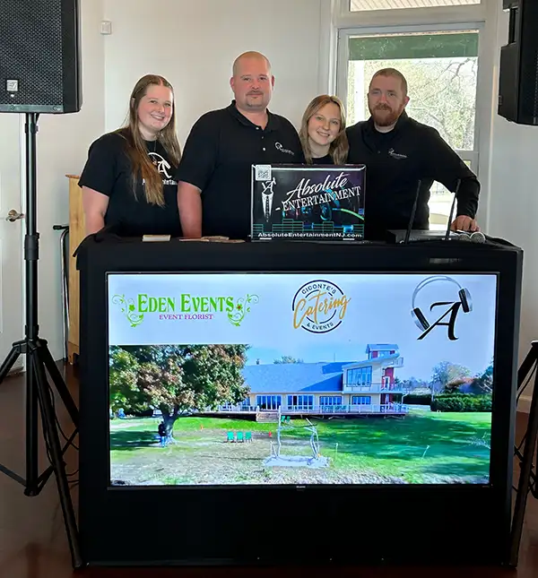 Absolute Entertainment employees at a booth